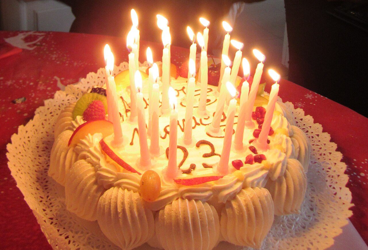 A birthday cake with lit candles